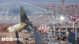 Why was there a wall near the runway?