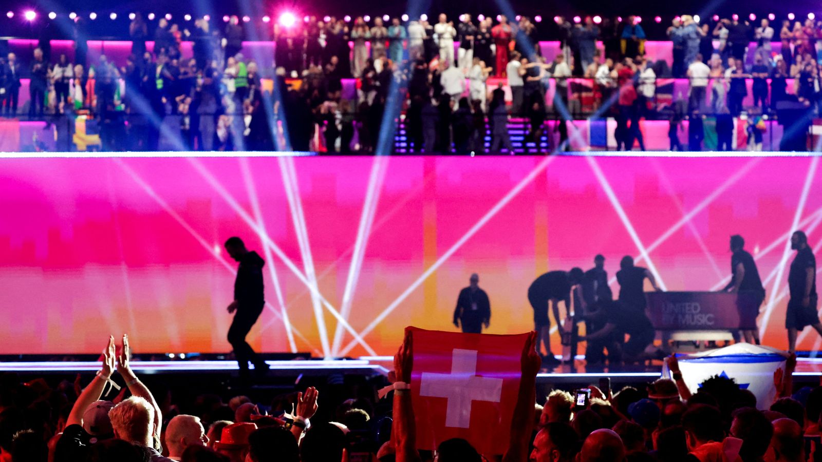 A member of the audience holds Switzerland's flag during the Grand Final of the 2024 Eurovision Song Contest, in Malmo, Sweden, May 12, 2024. REUTERS/Leonhard Foeger REFILE - CORRECTING DATE