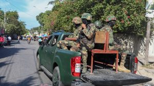 Soldiers patrol a street in Port-au-Prince, Haiti, Monday, Dec. 2, 2024. (AP Photo/Odelyn Joseph)