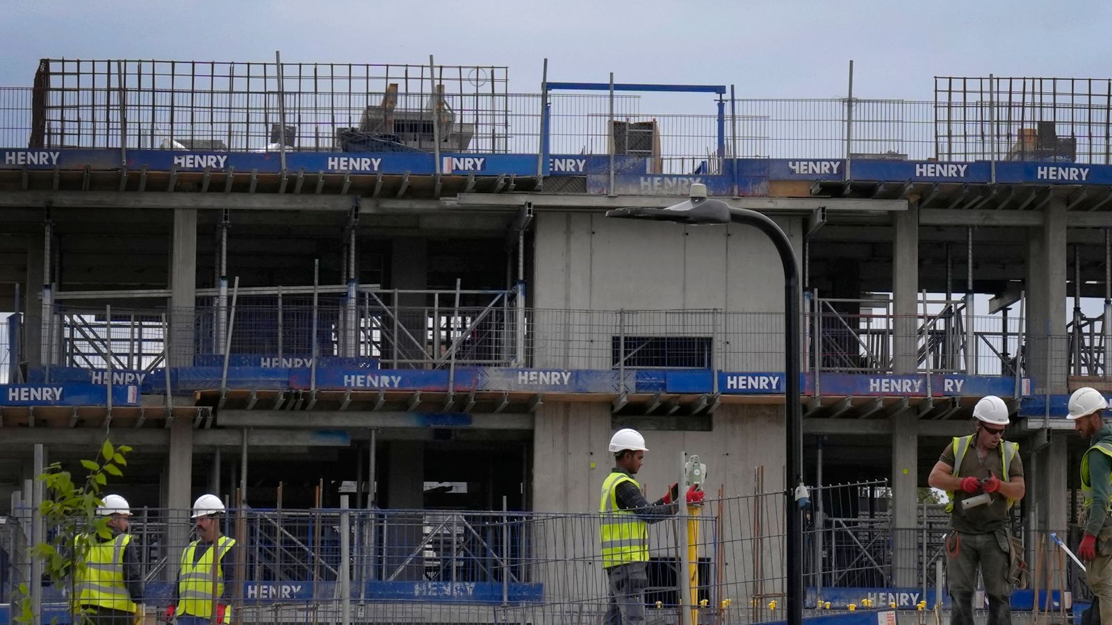 Construction workers on a site in London, Friday, Sept. 23, 2022. Britain's new government on Friday announced a sweeping plan of tax cuts it said would be funded by borrowing and revenues generated by anticipated growth, as part of contentious moves to combat the cost-of-living crisis and bolster a faltering economy. (AP Photo/Kirsty Wigglesworth)