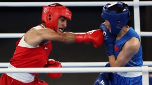 Imran Khelife, left, during her gold medal winning bout. Pic: Reuters