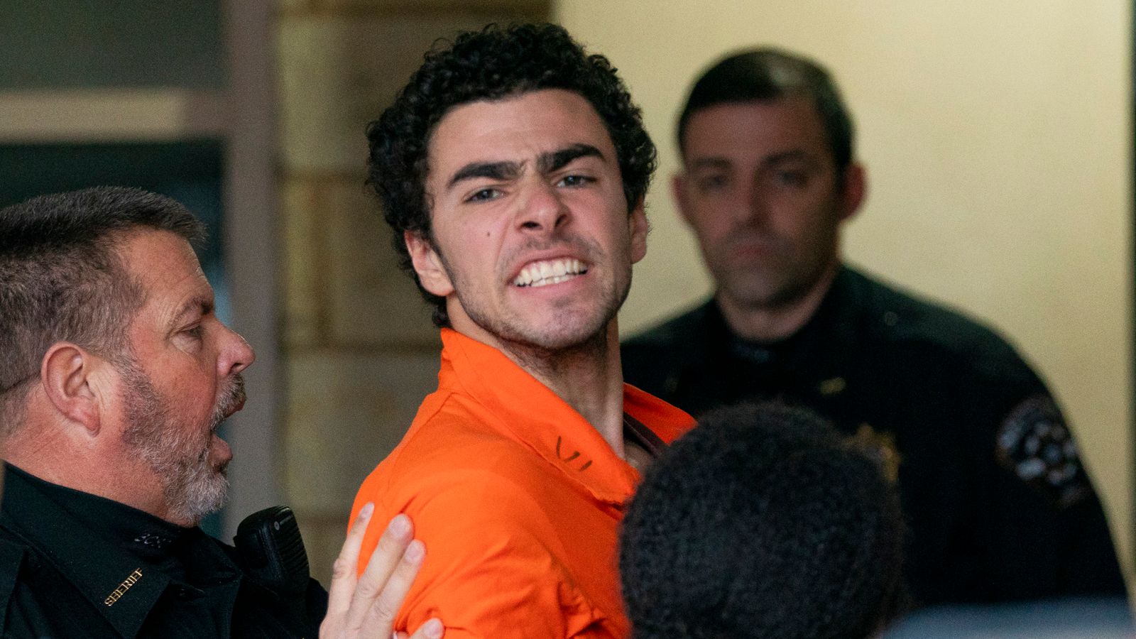 Suspect Luigi Mangione is taken into the Blair County Courthouse on Tuesday, Dec. 10, 2024, in Hollidaysburg, Pa. (Benjamin B. Braun/Pittsburgh Post-Gazette via AP)