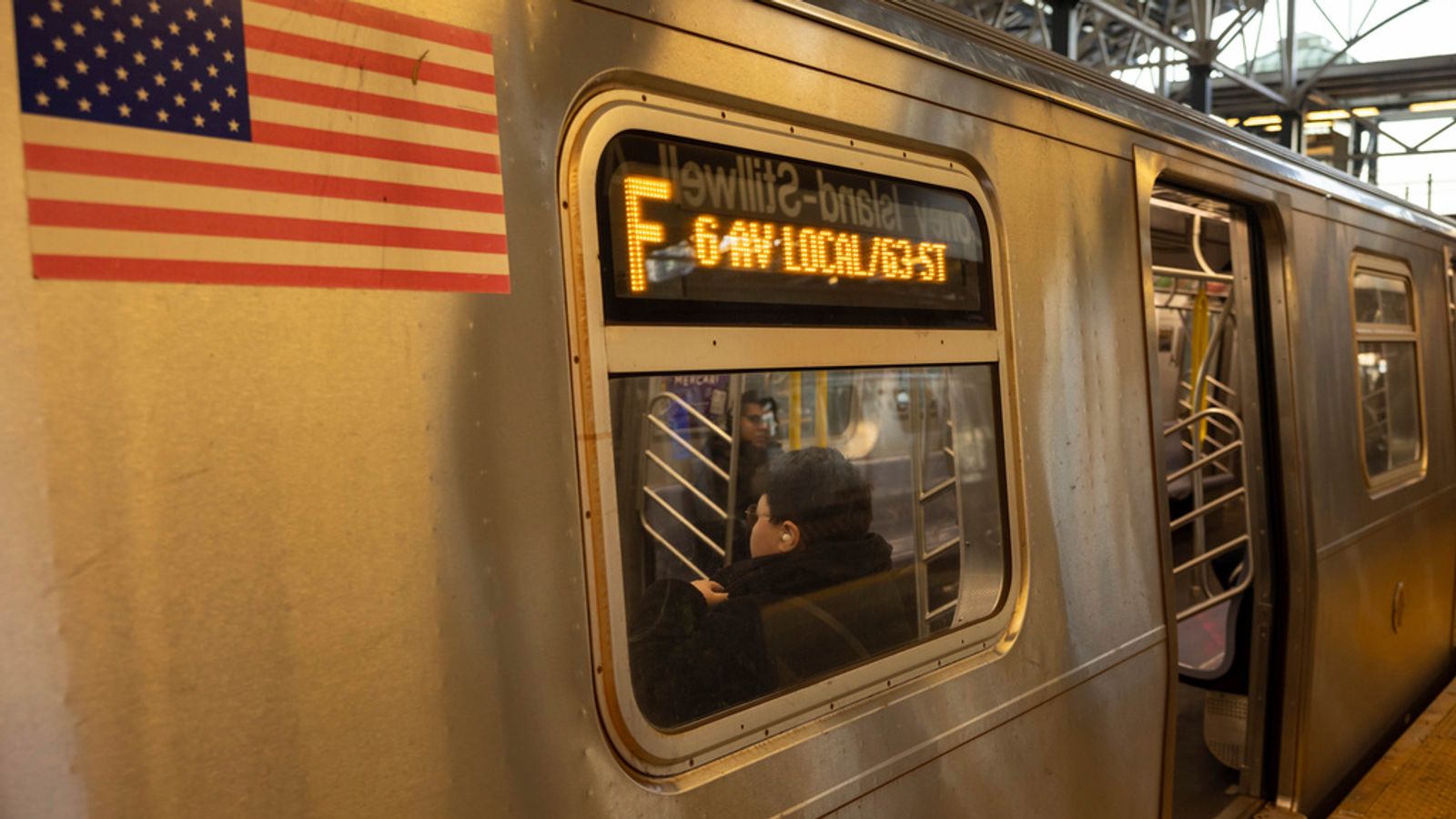 FILE - Commuters sit on the F train at the Coney Island-Stillwell Avenue Station, Thursday, Dec. 26, 2024, in New York. Pic: AP