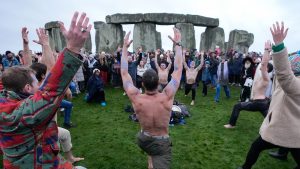 People take part in the winter solstice celebrations during sunrise at the Stonehenge prehistoric monument on Salisbury Plain in Wiltshire. Picture date: Saturday December 21, 2024. PA Photo. See PA story SOCIAL Solstice. Photo credit should read: Andrew Matthews/PA Wire