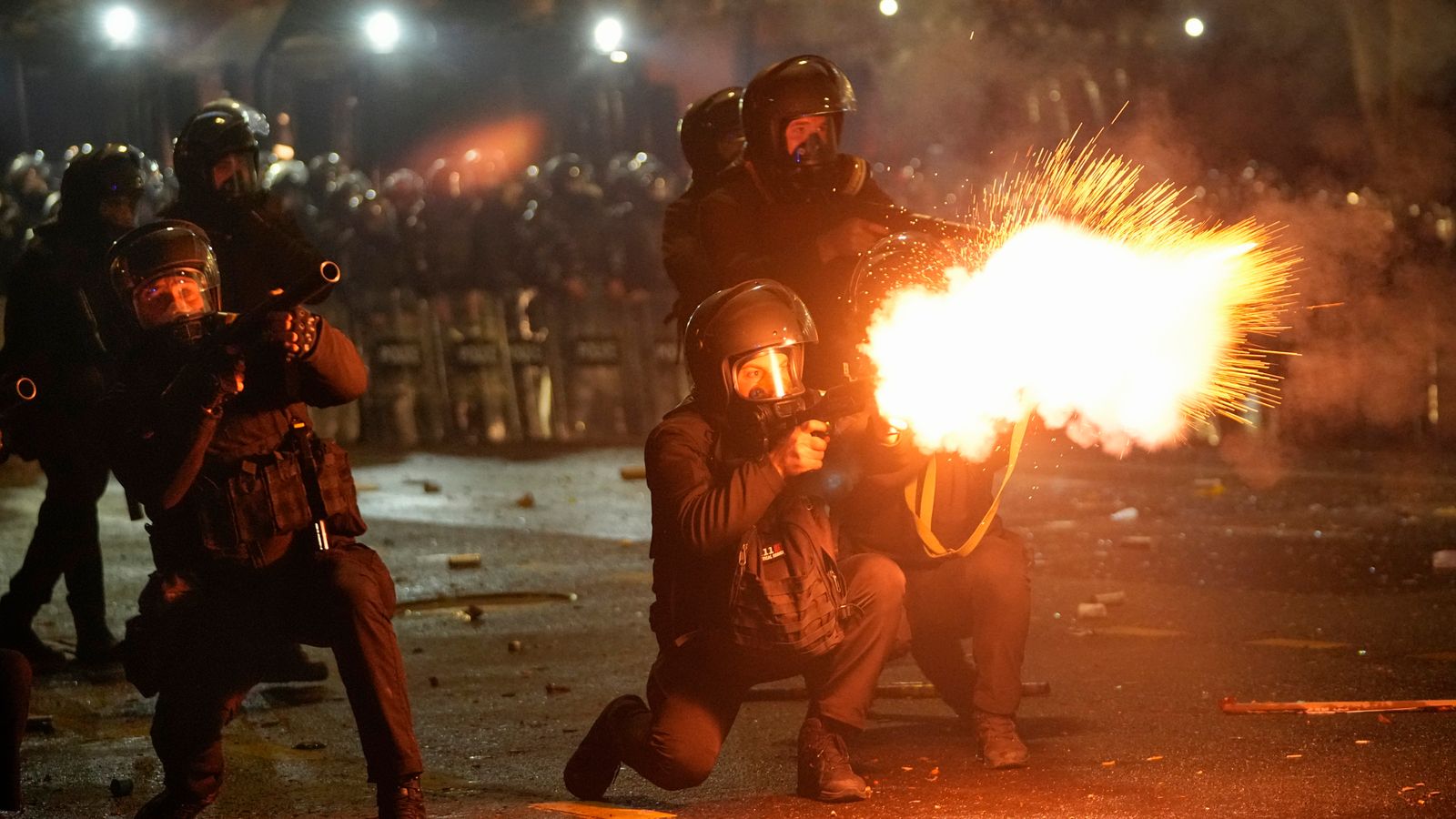 Police fire tear gas towards protesters in the Georgian capital Tbilisi. Pic: AP