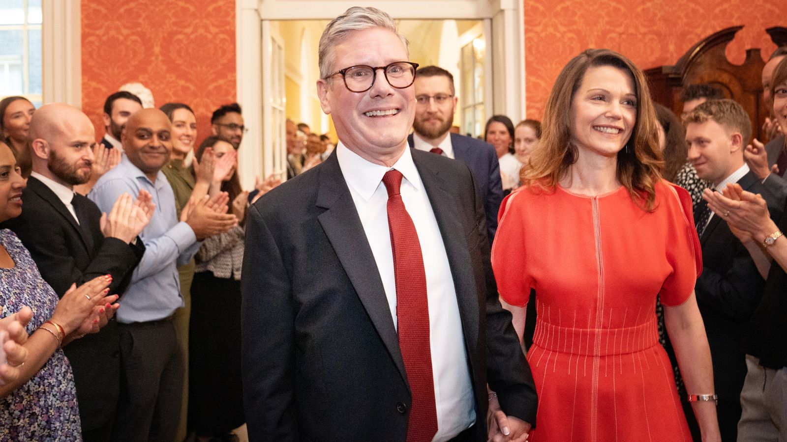 Newly elected Prime Minister Sir Keir Starmer with his wife Victoria Starmer are clapped in by staff as they enter his official London residence at No 10 Downing Street for the first time after the Labour Party won a landslide victory at the 2024 General Election. Picture date: Friday July 5, 2024.