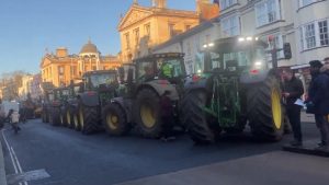 Angry farmers disrupt minister’s speech with loud tractor tax protest | News