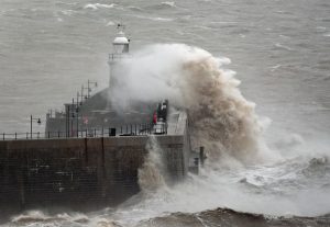 Britain sees in the New Year with heavy downpours with snow expected this weekend