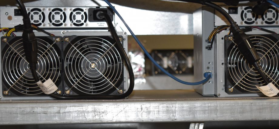 A photo of four mining rigs