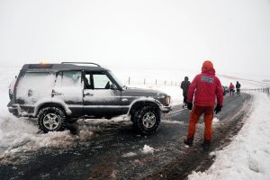 UK weather live: Fresh snow and ice warnings issued by Met Office as motorways flooded and trains cancelled