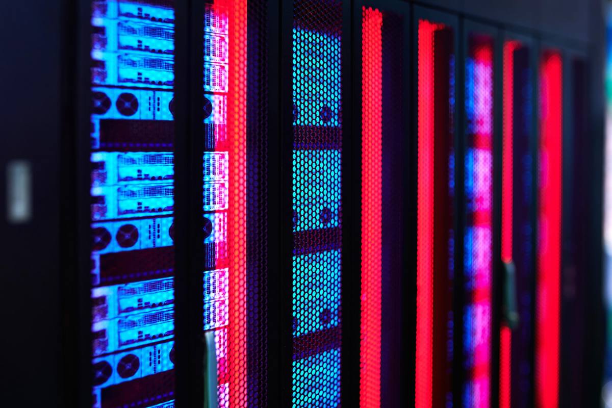 Servers glow in a data center rack.