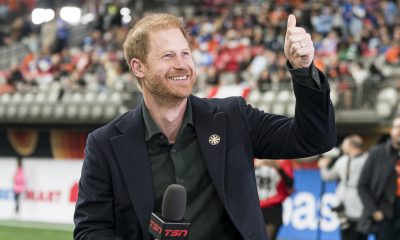 Prince Harry acknowledges fans prior to the start of a TV interview during pre-game festivities before the start of the 2024 Grey Cup at BC Place on November 17, 2024 in Vancouver, Canada.