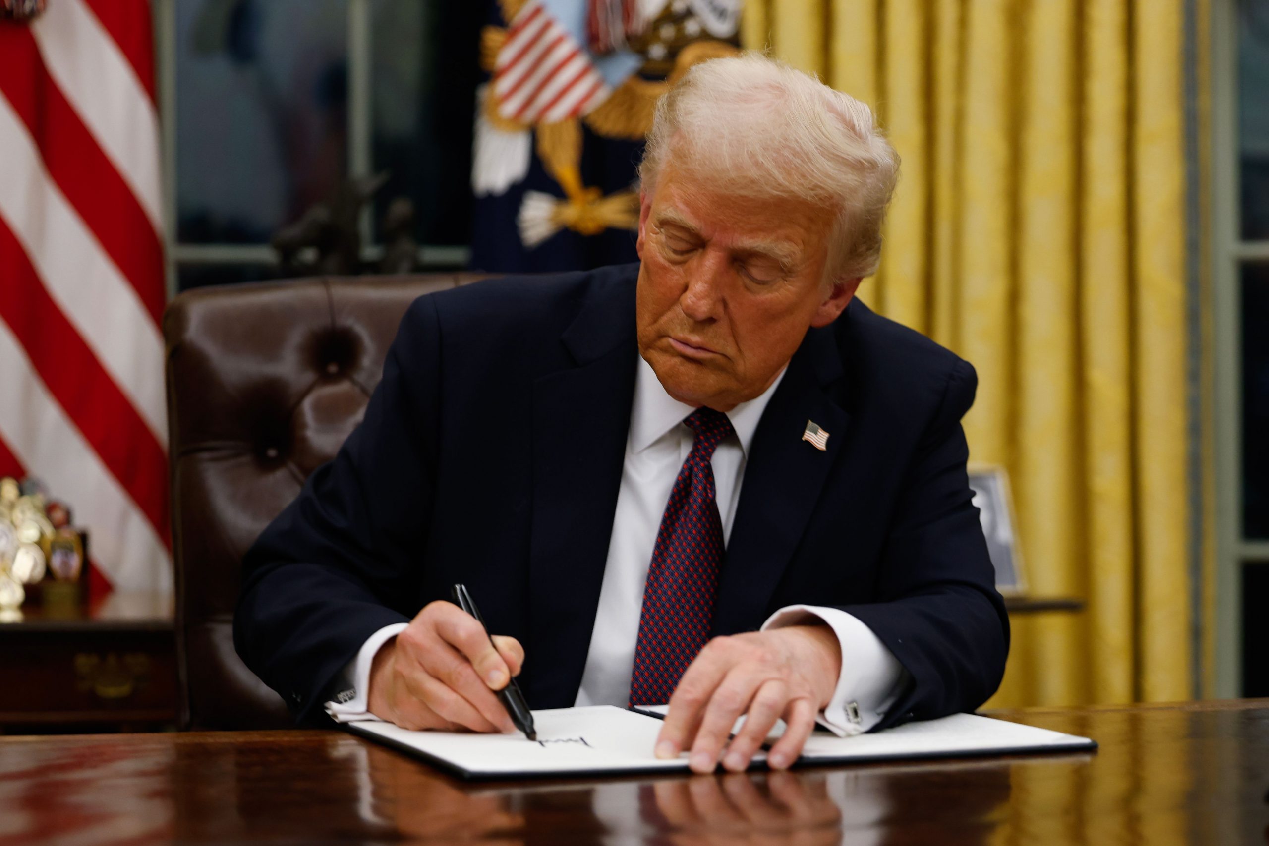 U.S. President Donald Trump signs executive orders