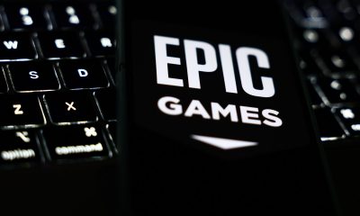 A laptop keyboard and Epic Games logo displayed on a phone screen are seen in this illustration photo taken in Krakow, Poland on October 1, 2024. (Photo by Jakub Porzycki/NurPhoto via Getty Images)