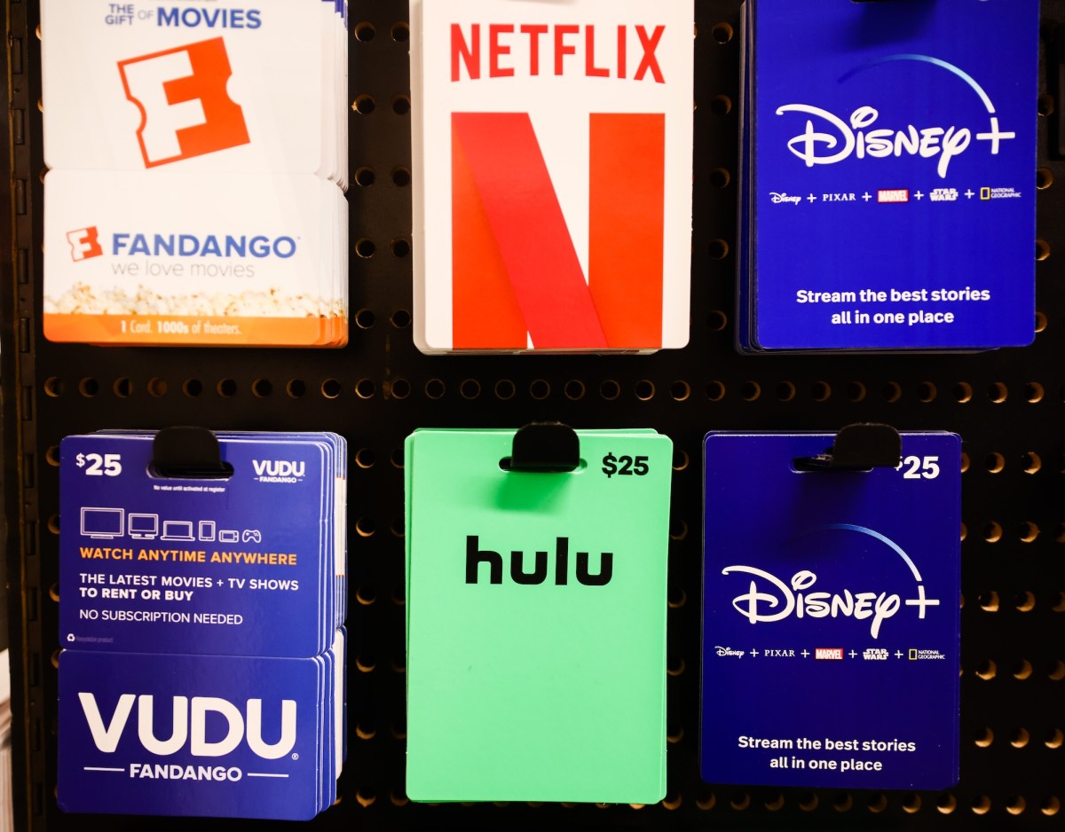 a selection of gift cards, including Hulu, Disney and Fandango, on a display at a store in New York