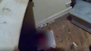 The suspect is found hiding under the bed. Pic: Greater Manchester Police