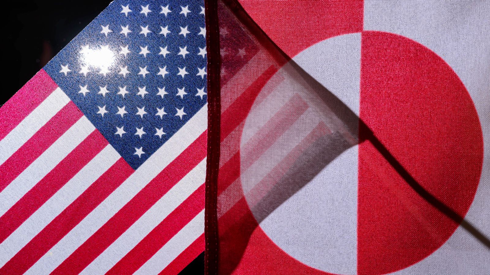 07 January 2025, Brandenburg, Sieversdorf: ILLUSTRATION: The flags of the USA (l) and Greenland hang next to each other (posed photo). US President-elect Trump has further fueled speculation about his interest in the island of Greenland. During his first term in office, Trump had already expressed interest in buying the resource-rich and strategically located island in the Arctic, but the Danish government flatly rejected the idea. Photo by: Patrick Pleul/picture-alliance/dpa/AP Images