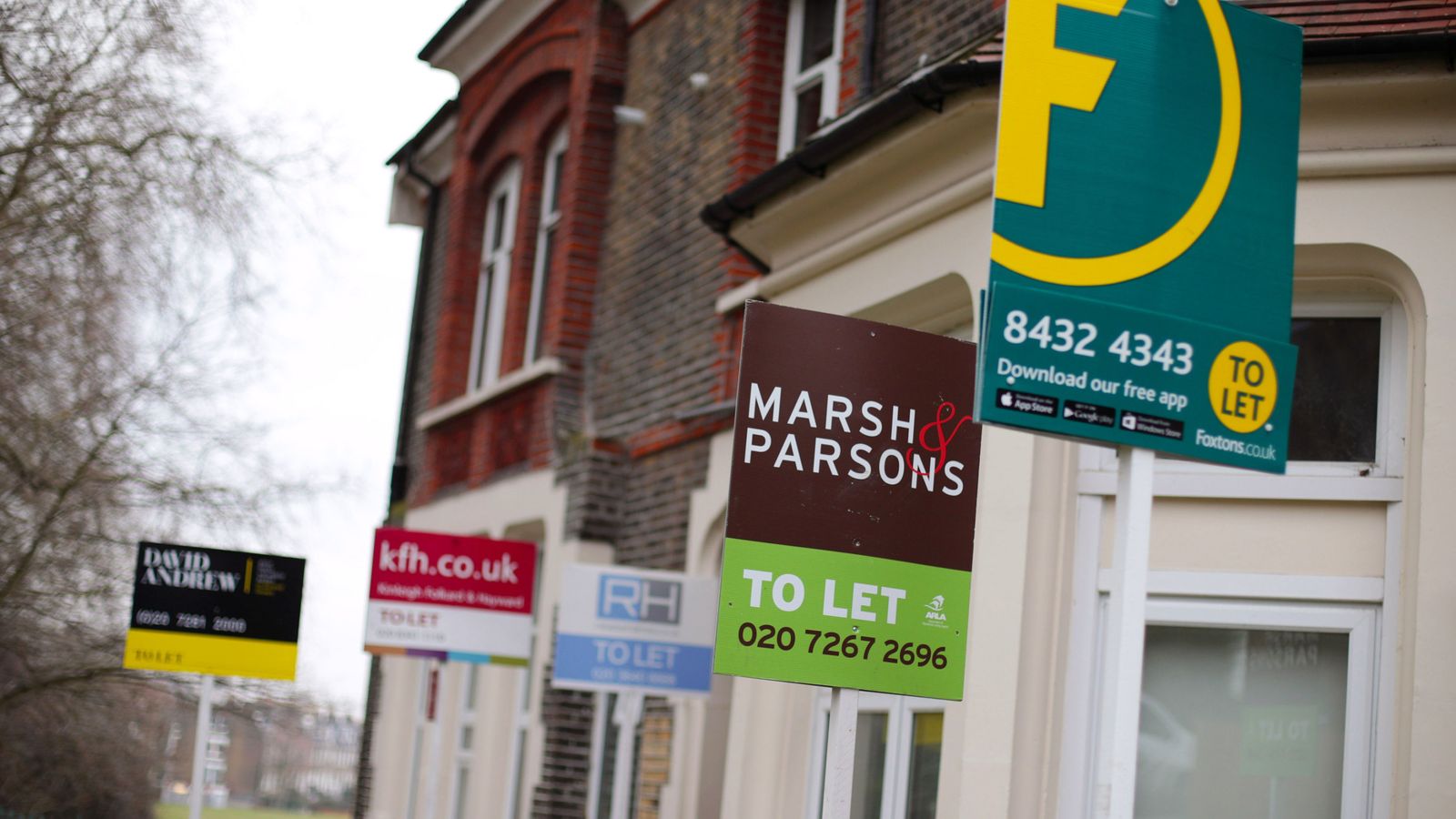 A row of letting agent signs placed outside houses. Around one in seven private renters in England have been hit by a rent hike in recent weeks, according to Shelter.