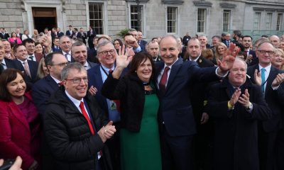 Fianna Fail leader Micheal Martin (centre) with his wife Mary outside Leinster House, Dublin, after he was selected as the new Taoiseach. Pic: PA