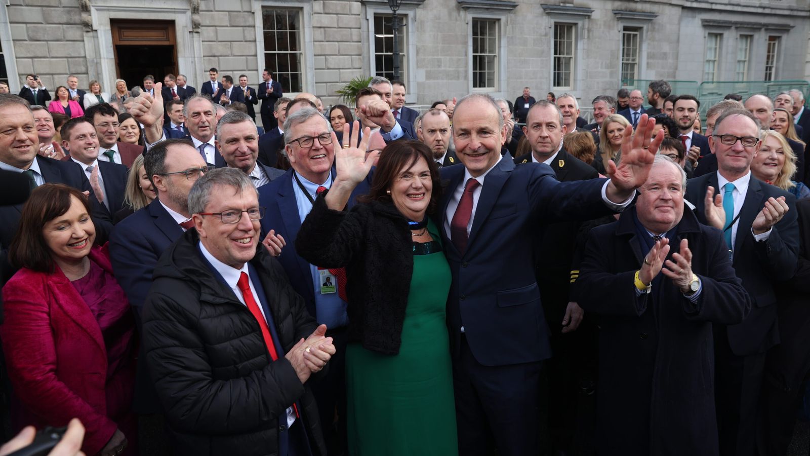 Fianna Fail leader Micheal Martin (centre) with his wife Mary outside Leinster House, Dublin, after he was selected as the new Taoiseach. Pic: PA