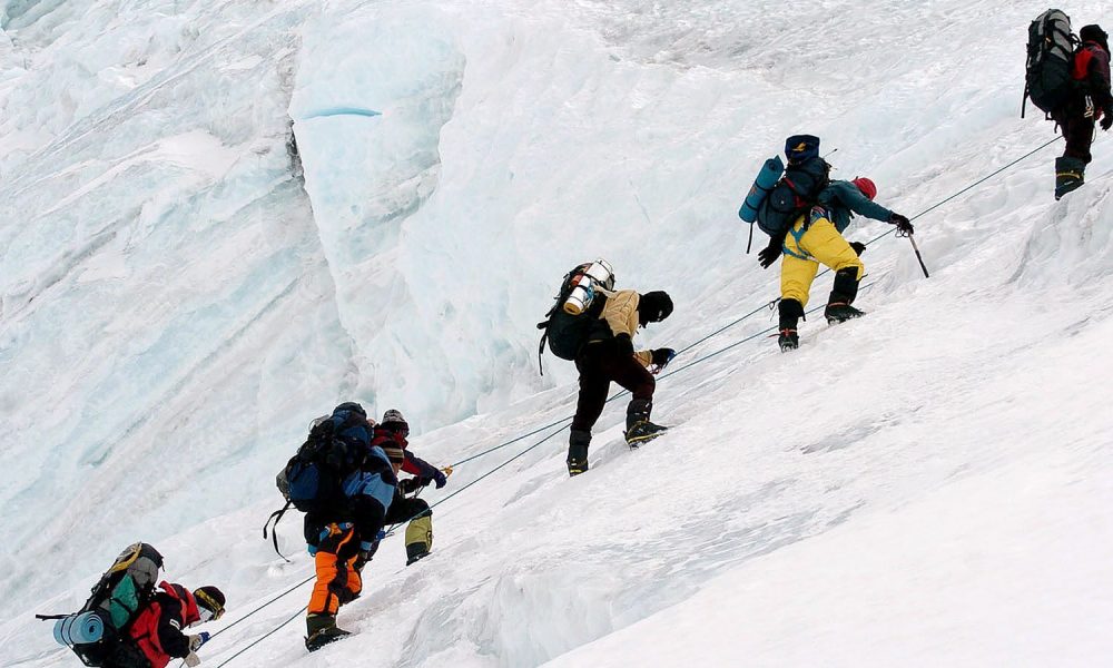 An expedition team climbing Mount Everest. Pic: AP