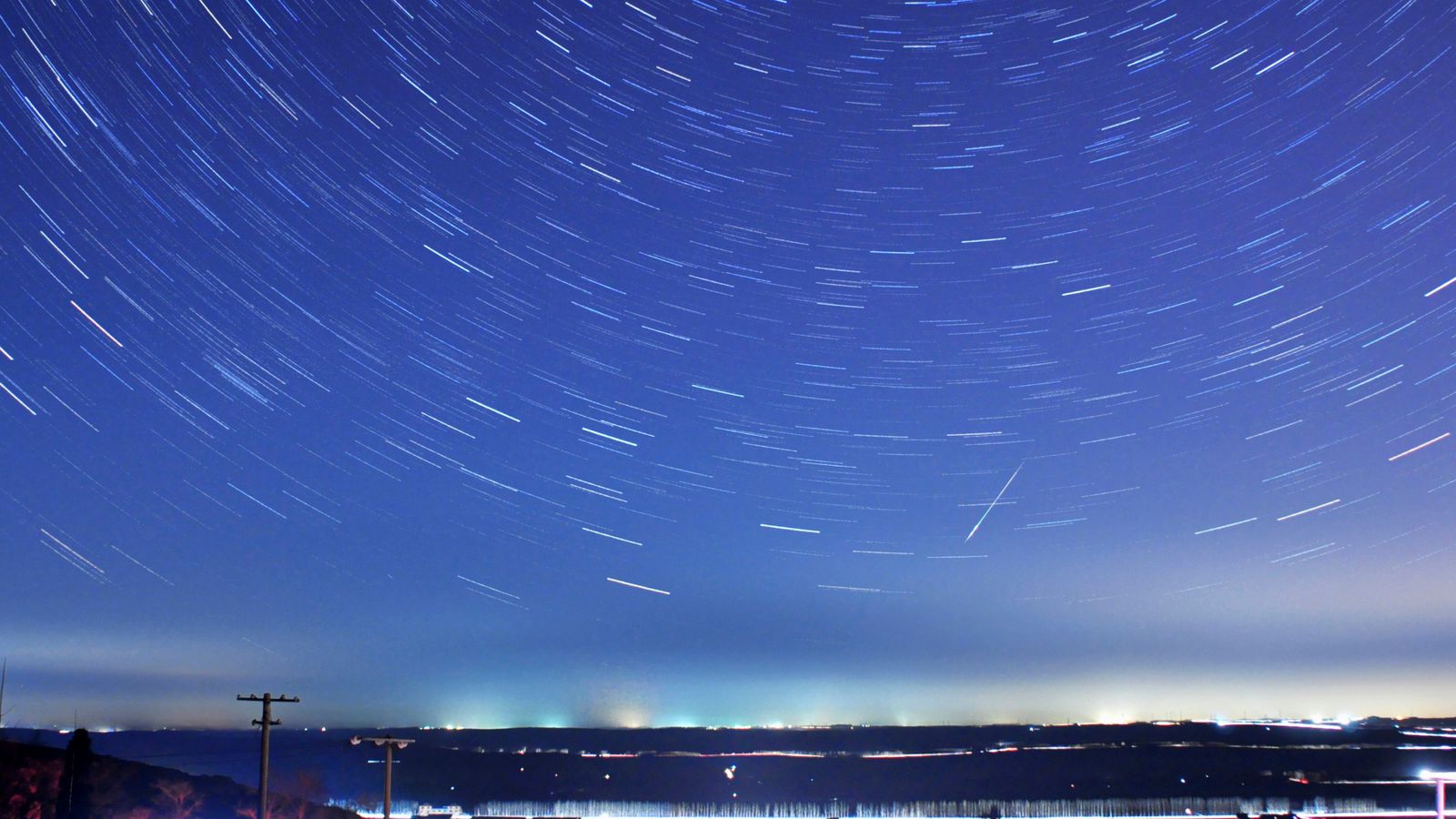 A meteor streaks past stars during the annual Quadrantid meteor shower in Qingdao, China