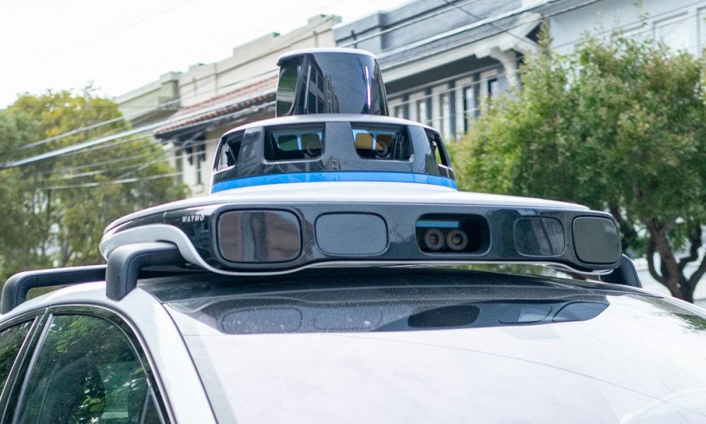 A Waymo self-driving car is seen in the Inner Richmond neighborhood of San Francisco, California, with the Lidar unit on the vehicle visible, November 17, 2024.