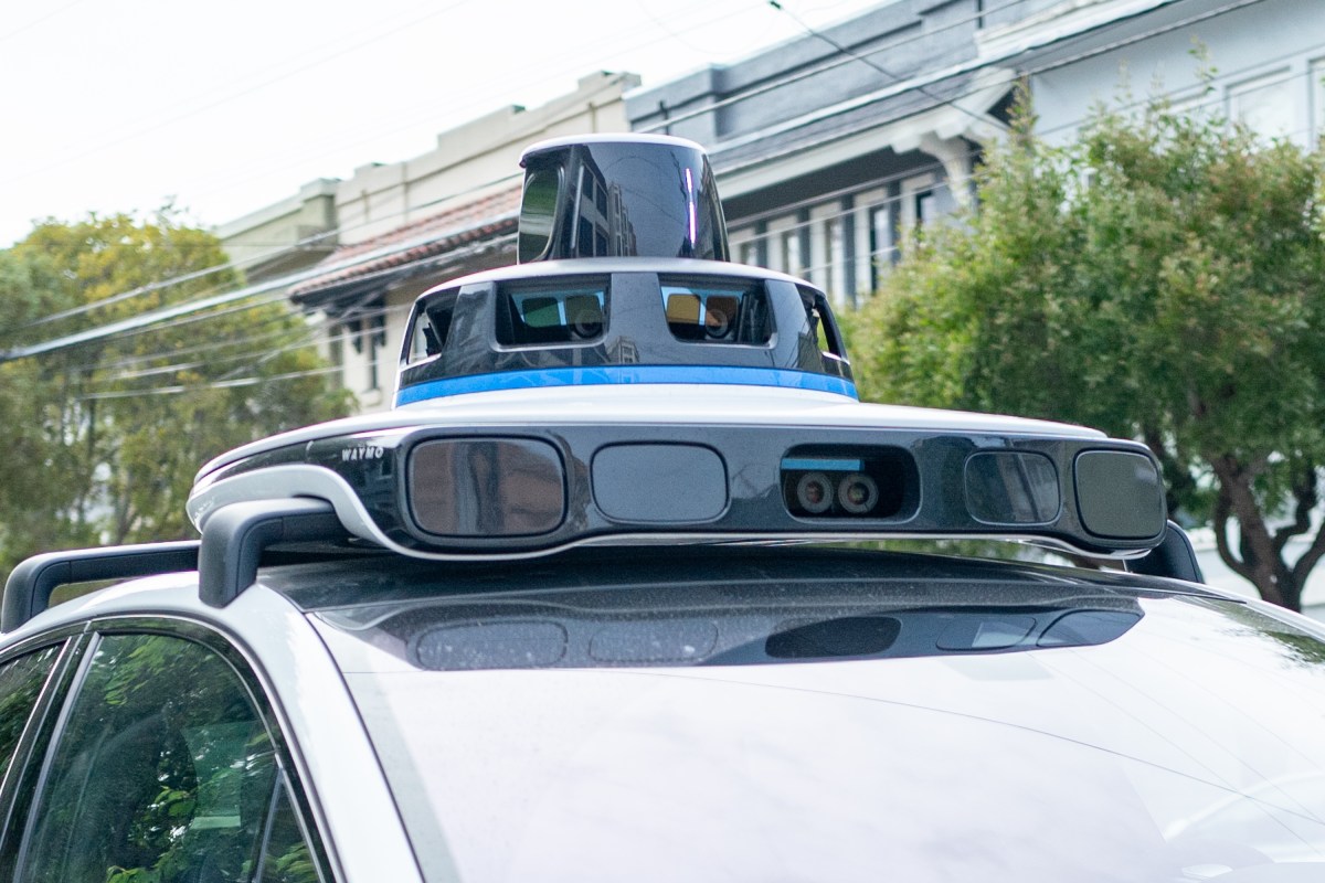 A Waymo self-driving car is seen in the Inner Richmond neighborhood of San Francisco, California, with the Lidar unit on the vehicle visible, November 17, 2024.