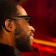 Cory Henry wearing Beyerdynamic's new pro-specific IEMs, sitting at a piano