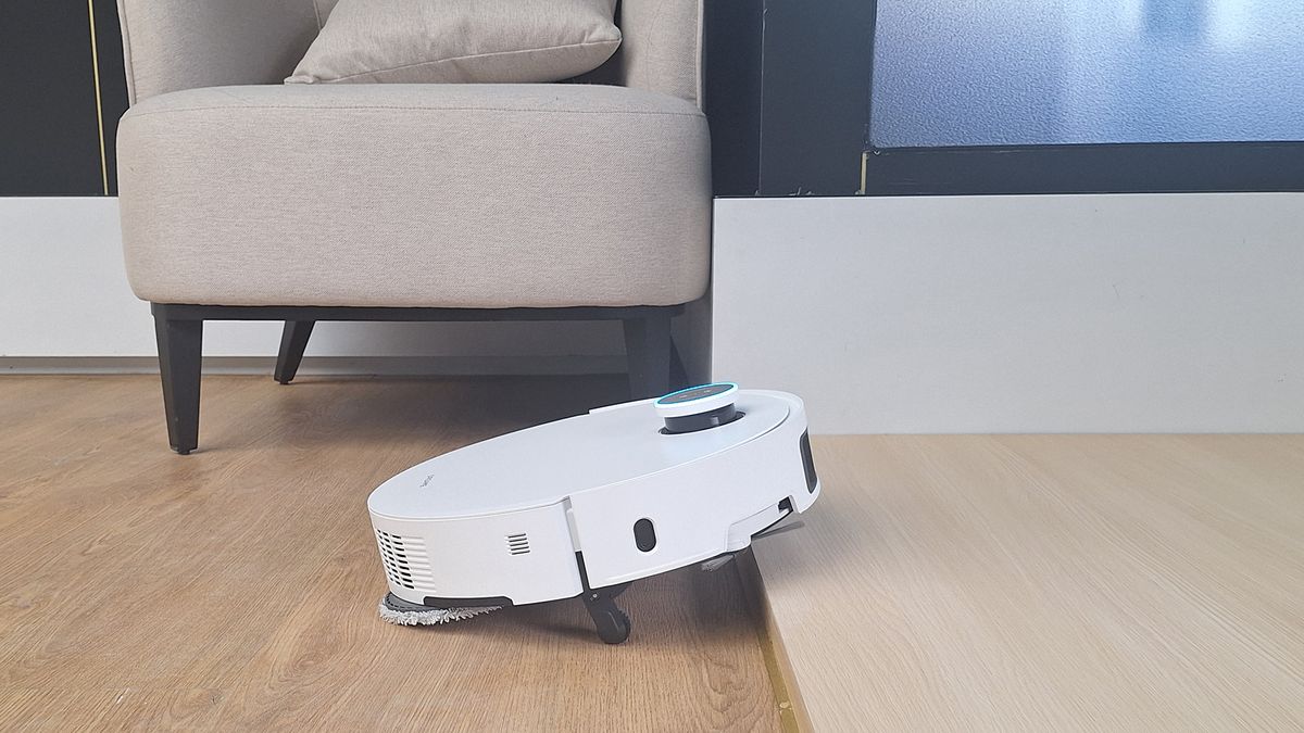 Dreame X50 Ultra Complete robot vacuum lifting up as it approaches a step