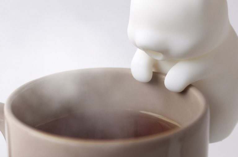 This tiny robot cat will blow on your coffee to cool it off