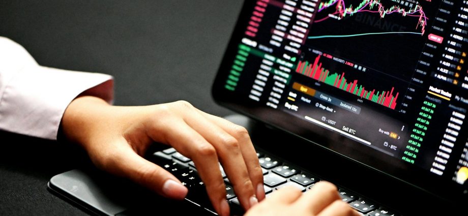 Binance investor on ipad with keyboard (Kanchanara/Unsplash)