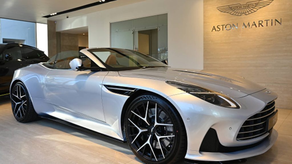 shares of luxury carmaker pop on plans to raise cash