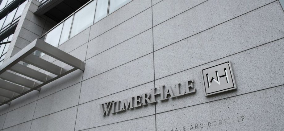 Two Big Law Firms Sue Trump as Third Settles to Avoid Order
