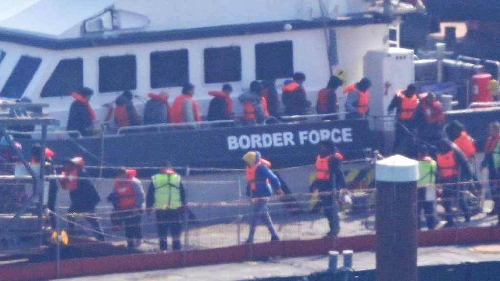A group thought to be migrants are brought in to Dover after a small boat incident in the Channel on 27 March. Pic: PA