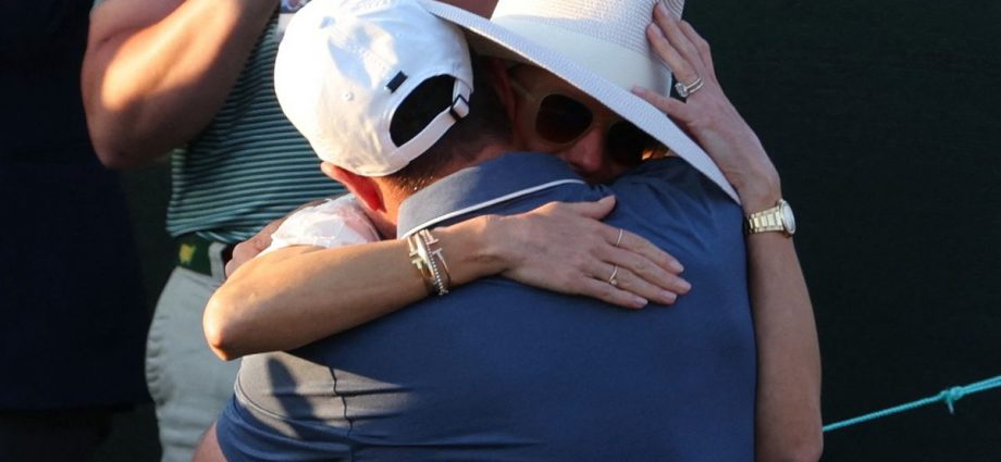 Rory McIlroy embraces wife Erica Stoll after breaking down in tears following Masters triumph