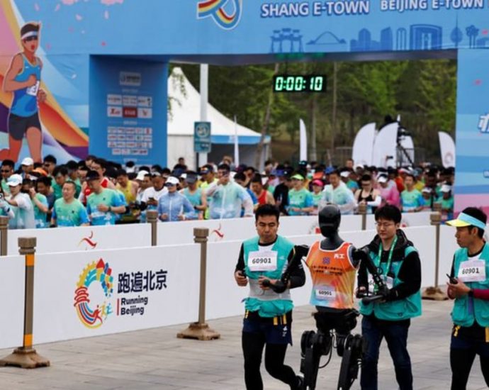 China pits humanoid robots against humans in half-marathon