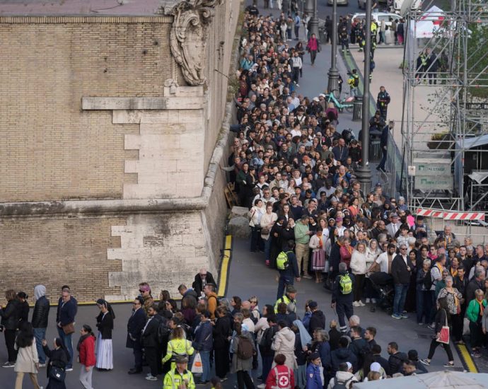 Mourners queue overnight to see popular Pope as Vatican extends opening hours