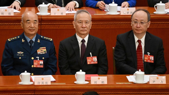 Former vice-chair of China’s Central Military Commission Xu Qiliang, former vice-premier Liu He and Beijing Communist Party secretary Yin Li attend the closing session of the National People’s Congress in Beijing on March 13, 2023.