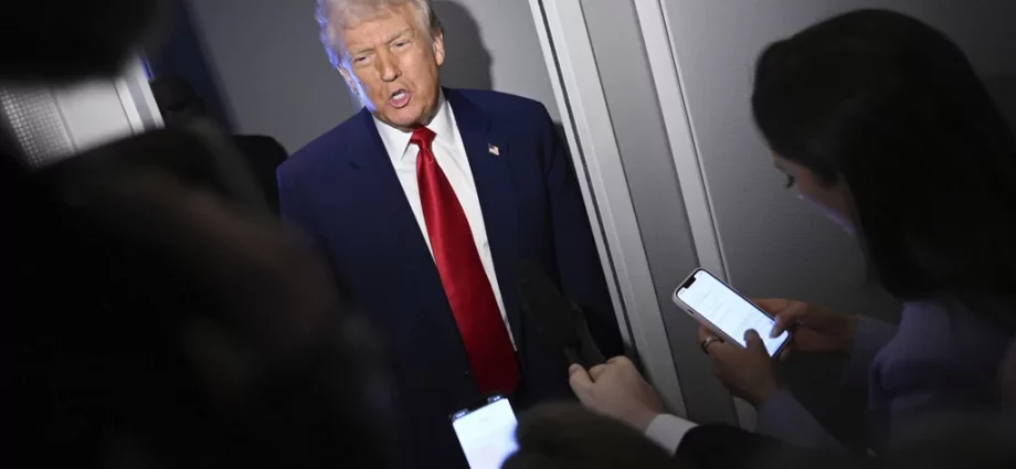 President Donald Trump speaks to reporters while in flight on board Air Force One, en route to Miami, Thursday, April 3, 2025.