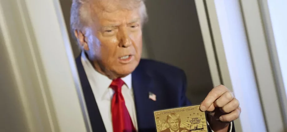 President Donald Trump holds up the $5 million gold card as he speaks to reporters while in flight on board Air Force One, en route to Miami, Thursday, April 3, 2025.
