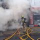Over 100 firefighters tackling blaze at shop on east London high street