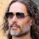 Comedian Russell Brand to enter pleas to rape and sexual assault charges