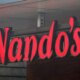 Nando's back in profit - but warns on tax rises