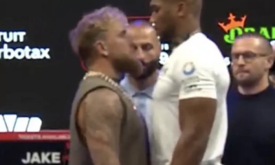 Anthony Joshua towers over rival Jake Paul in first face-off