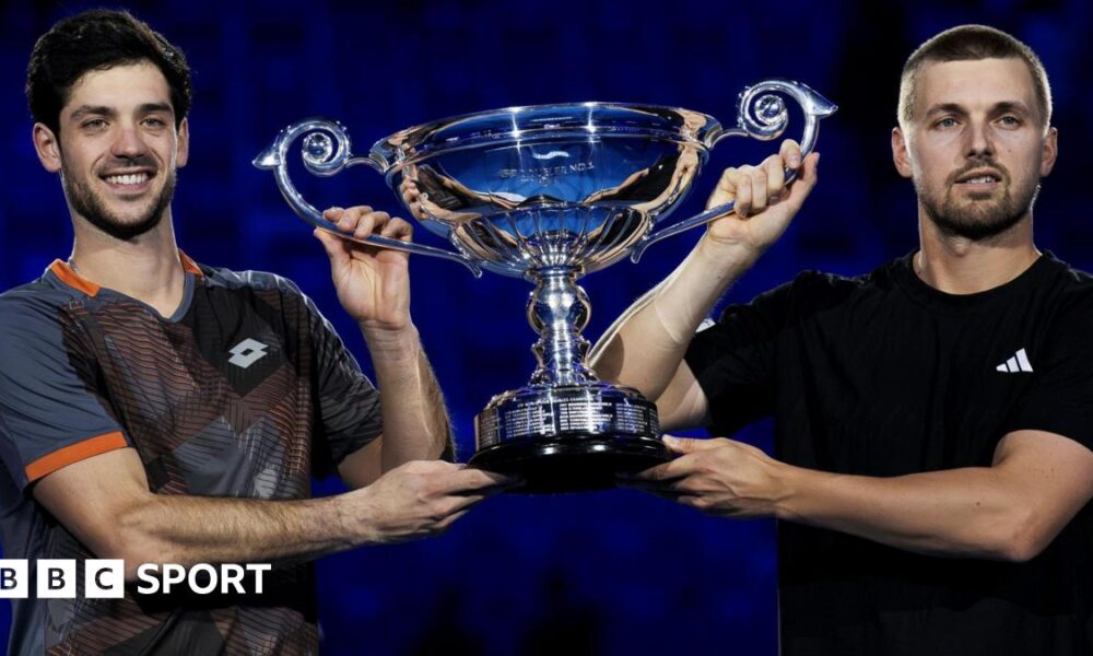 Julian Cash and Lloyd Glasspool lift the trophy for finishing as the leading ATP Tour doubles pair in 2025