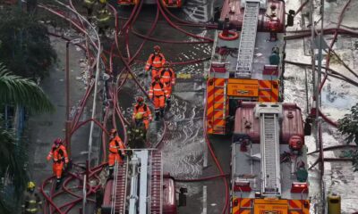 Hong Kong mourns victims of blaze that killed 128 and counting