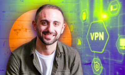 image of Mike De Socio smiling with a VPN green glowing symbol in the background