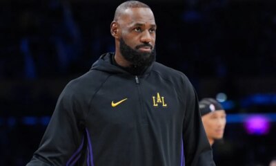 LeBron James steps away from the Lakers in the tunnel to share a moment with his mom