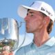 David Puig kissing the Australian PGA Championship trophy